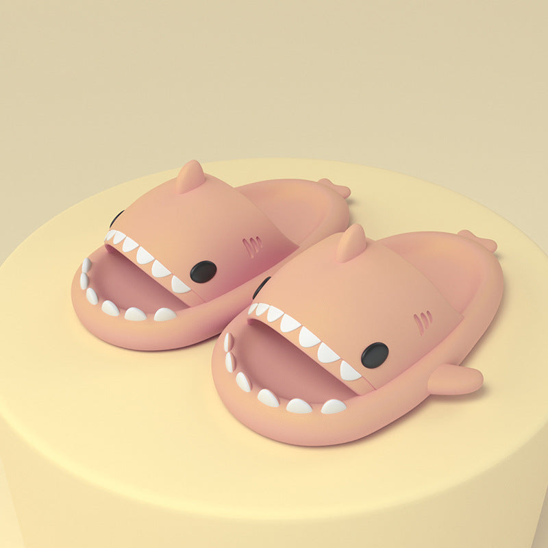 Pink cartoon shark slides on feet